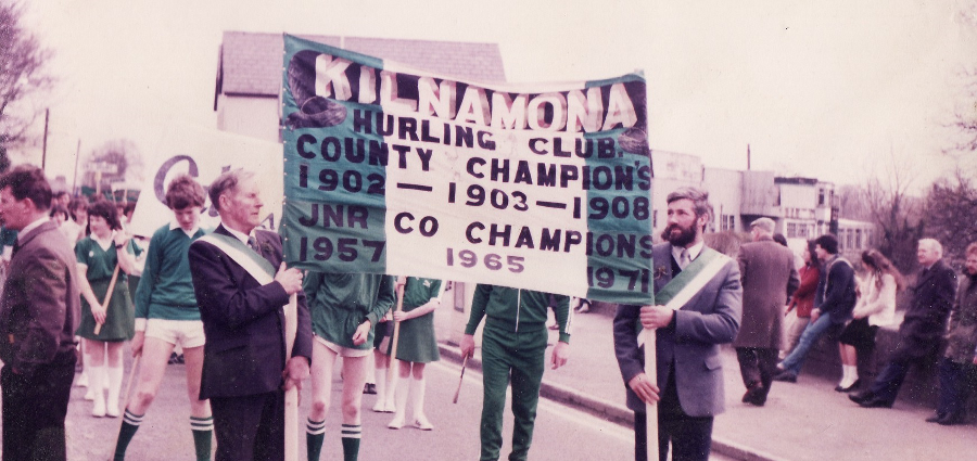 Michael Hegarty and Mike O'Leary raise the Kilnamona banner at F&eacute;ile na nGael